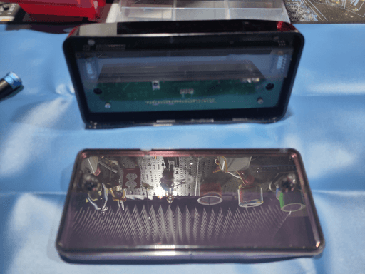 A squeezebox classic with the front panel removed, exposing the motherboard.