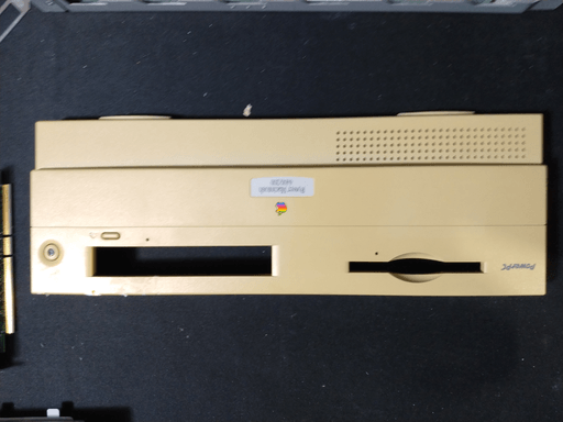 The front panel after taking it off of the computer sitting on a desk