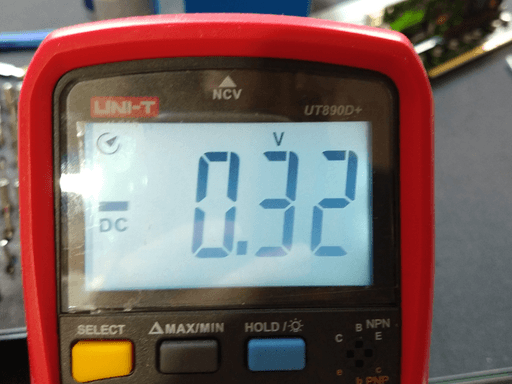 -0.32 volts shown on a multimeter.