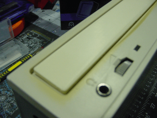 cd drive with a beige front standing upright