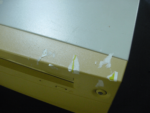 A picture of the sticker residue on the top right of the front case plastic.