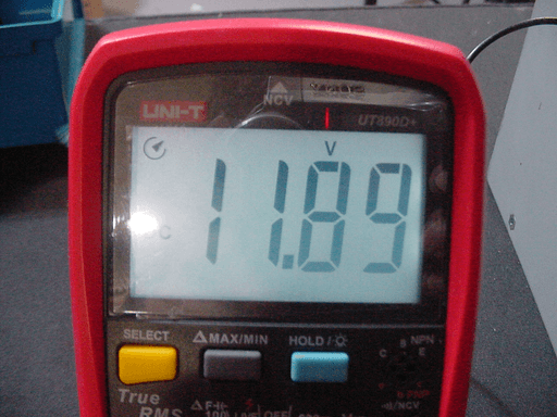 11.89 volts shown on a multimeter.