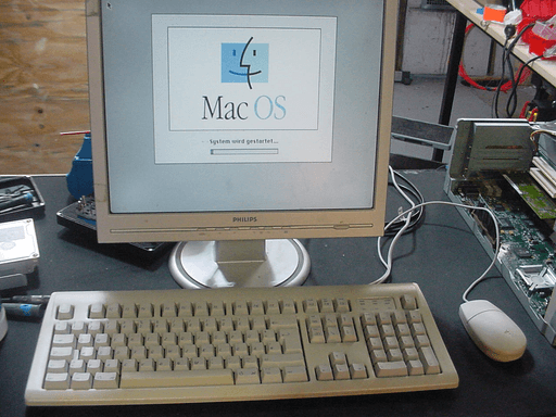 MacOS booting up with ADB HIDs in front of the monitor.