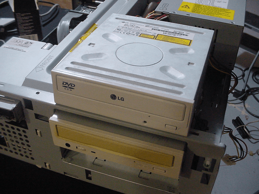 A CD drive with the LG-logo on the front sitting on top of another CD drive.