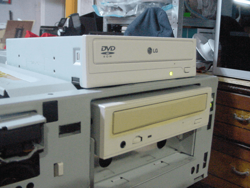 A CD drive with the LG-logo on the front sitting on top of another CD drive.