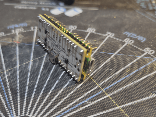 A raspberry pi pico pcb soldered to another pcb with the same size.