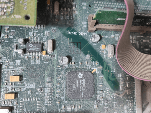 A dusty PCB with one clean area where a finger ran across.