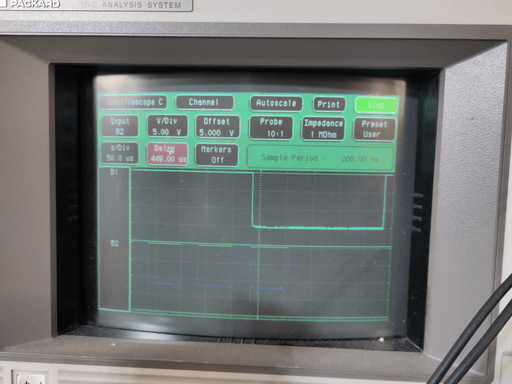 A photo of a washed-out CRT displaying the interface of an oscilloscope.