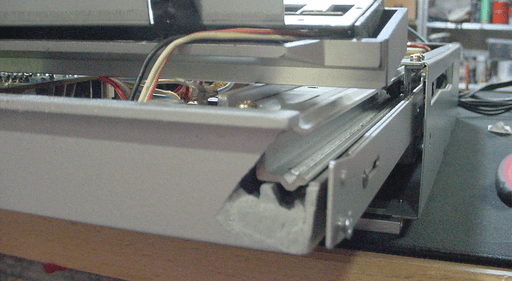 A photo of the plastic area behind the control panel. On the bottom right side is a pice missing.