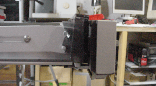 A photo of the left-hand side of the front flap inside the record player with part of it broken of.